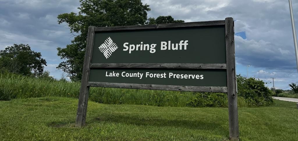 Spring Bluff Lake County Forest Preserves sign in a natural outdoor setting